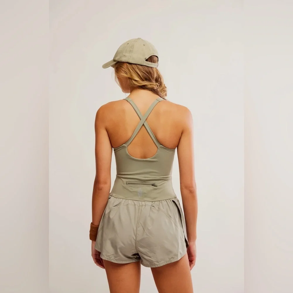 new Free People righteous runsie active romper in sage stone green